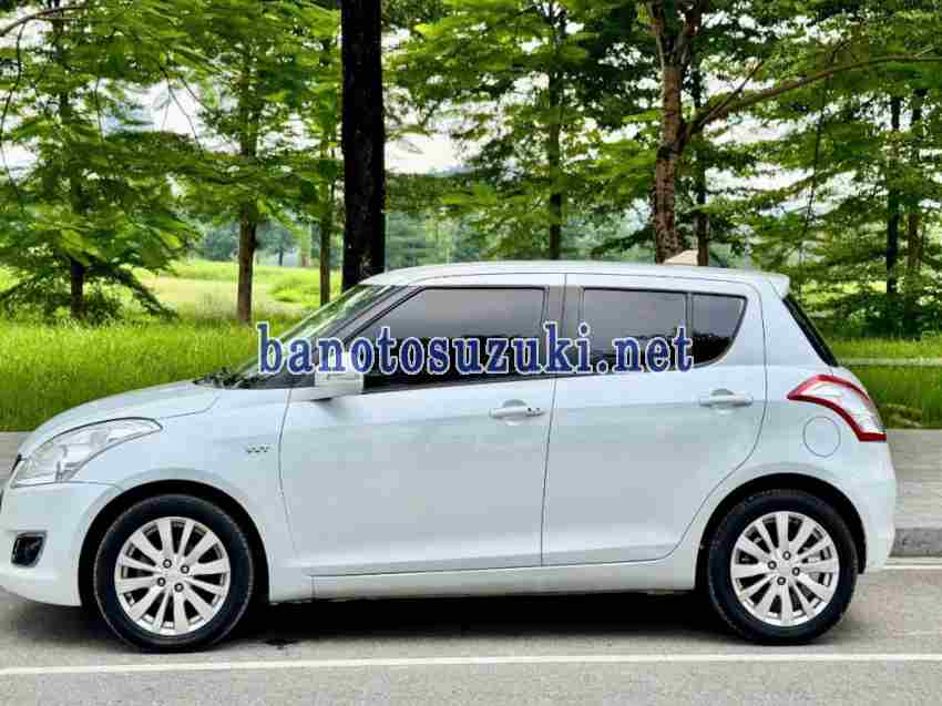 Cần bán gấp xe Suzuki Swift 1.4 AT 2014 màu Trắng